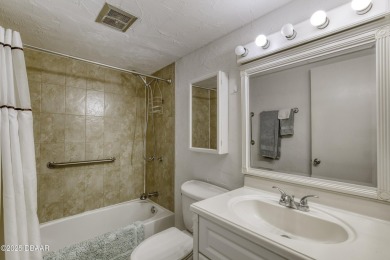 Enjoy easy living in this beautifully furnished 2-bedroom on Daytona Beach Golf Club in Florida - for sale on GolfHomes.com, golf home, golf lot