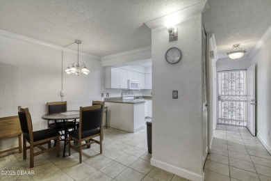 Enjoy easy living in this beautifully furnished 2-bedroom on Daytona Beach Golf Club in Florida - for sale on GolfHomes.com, golf home, golf lot
