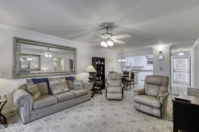 Enjoy easy living in this beautifully furnished 2-bedroom on Daytona Beach Golf Club in Florida - for sale on GolfHomes.com, golf home, golf lot
