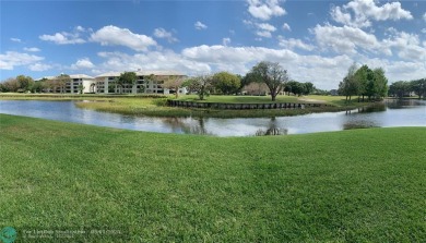 Surrounded by water on 2 sides, this UPDATED 2BR/2BA *corner* on Pine Island Ridge Country Club in Florida - for sale on GolfHomes.com, golf home, golf lot
