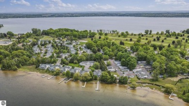Bass Lake front Quality Condo with sunset views. Tile, Granite on Elk Rapids Golf Club in Michigan - for sale on GolfHomes.com, golf home, golf lot