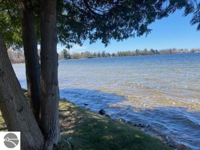 Bass Lake front Quality Condo with sunset views. Tile, Granite on Elk Rapids Golf Club in Michigan - for sale on GolfHomes.com, golf home, golf lot