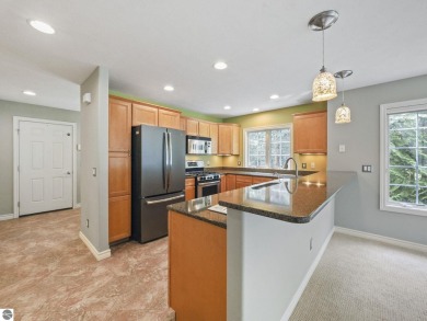 Bass Lake front Quality Condo with sunset views. Tile, Granite on Elk Rapids Golf Club in Michigan - for sale on GolfHomes.com, golf home, golf lot