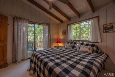 This cozy chalet offers the classic A-frame design with a on Innsbrook Resort Golf Course in Missouri - for sale on GolfHomes.com, golf home, golf lot