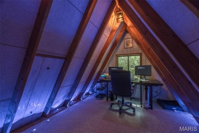 This cozy chalet offers the classic A-frame design with a on Innsbrook Resort Golf Course in Missouri - for sale on GolfHomes.com, golf home, golf lot