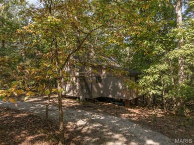 This cozy chalet offers the classic A-frame design with a on Innsbrook Resort Golf Course in Missouri - for sale on GolfHomes.com, golf home, golf lot