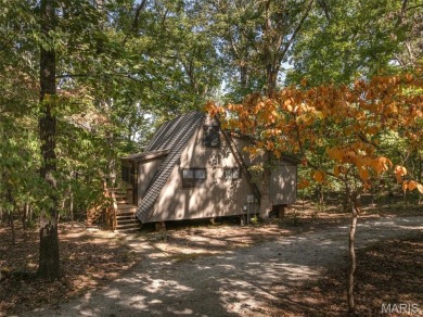 This cozy chalet offers the classic A-frame design with a on Innsbrook Resort Golf Course in Missouri - for sale on GolfHomes.com, golf home, golf lot