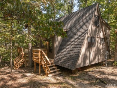 This cozy chalet offers the classic A-frame design with a on Innsbrook Resort Golf Course in Missouri - for sale on GolfHomes.com, golf home, golf lot