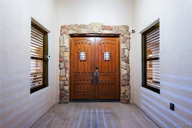 Nearly 6,000 Sq Ft of Purposeful Luxury with Dual Primary Suites on Laughlin Ranch Golf Club in Arizona - for sale on GolfHomes.com, golf home, golf lot