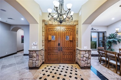 Nearly 6,000 Sq Ft of Purposeful Luxury with Dual Primary Suites on Laughlin Ranch Golf Club in Arizona - for sale on GolfHomes.com, golf home, golf lot