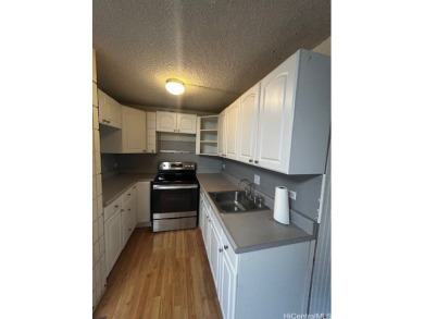 This centrally located unit features three bedrooms, two on Honolulu Country Club in Hawaii - for sale on GolfHomes.com, golf home, golf lot
