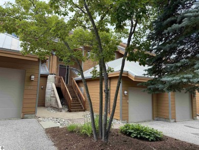 Ski-In/Ski-Out Shanty Creek Condo Overlooking the 18th Green - on Cedar River Golf Course in Michigan - for sale on GolfHomes.com, golf home, golf lot