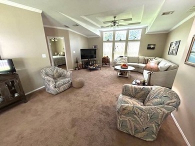 Welcome to this immaculately kept 3-bedroom, 2-bathroom home on Golf Hammock Country Club in Florida - for sale on GolfHomes.com, golf home, golf lot