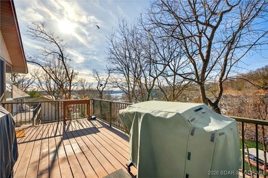 This stunning lakefront home in Four Seasons offers 75 feet of on Seasons Ridge At Four Seasons in Missouri - for sale on GolfHomes.com, golf home, golf lot