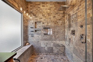 This stunning lakefront home in Four Seasons offers 75 feet of on Seasons Ridge At Four Seasons in Missouri - for sale on GolfHomes.com, golf home, golf lot