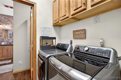 This stunning lakefront home in Four Seasons offers 75 feet of on Seasons Ridge At Four Seasons in Missouri - for sale on GolfHomes.com, golf home, golf lot