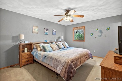 This stunning lakefront home in Four Seasons offers 75 feet of on Seasons Ridge At Four Seasons in Missouri - for sale on GolfHomes.com, golf home, golf lot