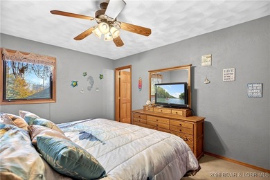 This stunning lakefront home in Four Seasons offers 75 feet of on Seasons Ridge At Four Seasons in Missouri - for sale on GolfHomes.com, golf home, golf lot