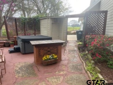 Look at this fantastically landscaped 3 bedroom 3 bathroom home on Garden Valley Golf Course Resort in Texas - for sale on GolfHomes.com, golf home, golf lot