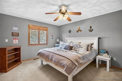 This stunning lakefront home in Four Seasons offers 75 feet of on Seasons Ridge At Four Seasons in Missouri - for sale on GolfHomes.com, golf home, golf lot