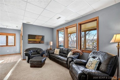 This stunning lakefront home in Four Seasons offers 75 feet of on Seasons Ridge At Four Seasons in Missouri - for sale on GolfHomes.com, golf home, golf lot