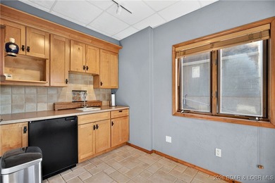 This stunning lakefront home in Four Seasons offers 75 feet of on Seasons Ridge At Four Seasons in Missouri - for sale on GolfHomes.com, golf home, golf lot