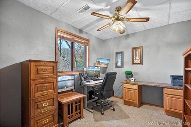 This stunning lakefront home in Four Seasons offers 75 feet of on Seasons Ridge At Four Seasons in Missouri - for sale on GolfHomes.com, golf home, golf lot