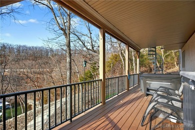 This stunning lakefront home in Four Seasons offers 75 feet of on Seasons Ridge At Four Seasons in Missouri - for sale on GolfHomes.com, golf home, golf lot