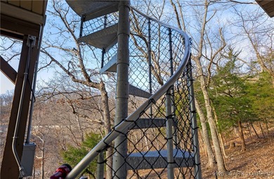 This stunning lakefront home in Four Seasons offers 75 feet of on Seasons Ridge At Four Seasons in Missouri - for sale on GolfHomes.com, golf home, golf lot