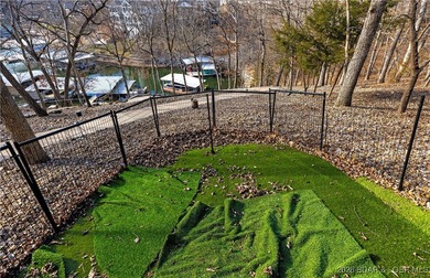 This stunning lakefront home in Four Seasons offers 75 feet of on Seasons Ridge At Four Seasons in Missouri - for sale on GolfHomes.com, golf home, golf lot