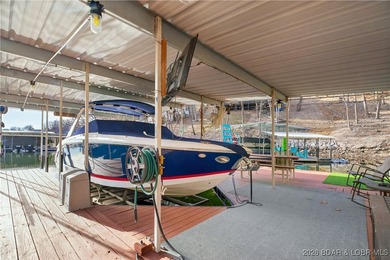 This stunning lakefront home in Four Seasons offers 75 feet of on Seasons Ridge At Four Seasons in Missouri - for sale on GolfHomes.com, golf home, golf lot