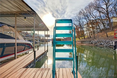 This stunning lakefront home in Four Seasons offers 75 feet of on Seasons Ridge At Four Seasons in Missouri - for sale on GolfHomes.com, golf home, golf lot