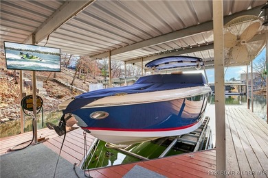 This stunning lakefront home in Four Seasons offers 75 feet of on Seasons Ridge At Four Seasons in Missouri - for sale on GolfHomes.com, golf home, golf lot