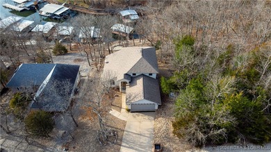 This stunning lakefront home in Four Seasons offers 75 feet of on Seasons Ridge At Four Seasons in Missouri - for sale on GolfHomes.com, golf home, golf lot
