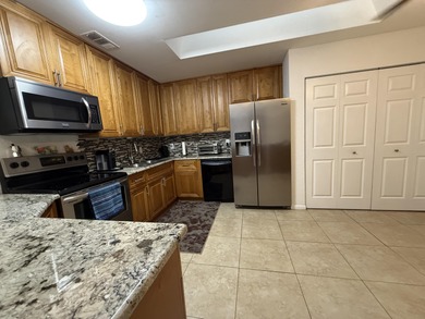 This corner unit villa with 3 bedrooms, 2 bathrooms and a one on Village Golf Club in Florida - for sale on GolfHomes.com, golf home, golf lot