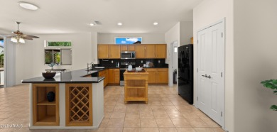 Coveted 3-car garage in The Grand! This open floor plan offers on Granite Falls Golf Club  in Arizona - for sale on GolfHomes.com, golf home, golf lot