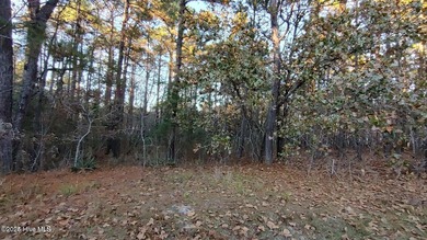 Don't miss this rare opportunity to own a 1.19-acre wooded lot on Foxfire Golf and Country Club in North Carolina - for sale on GolfHomes.com, golf home, golf lot