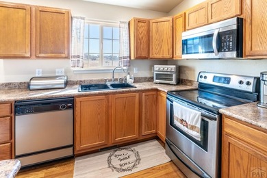 Move In ready classy home! Gracious floor plan and separates the on Desert Hawk At Pueblo West in Colorado - for sale on GolfHomes.com, golf home, golf lot