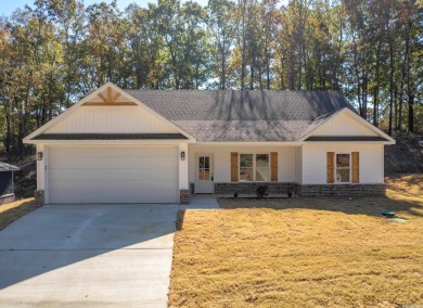 NEW CONSTRUCTION home in Diamondhead that backs up to a wooded on Diamondhead Golf and Country Club in Arkansas - for sale on GolfHomes.com, golf home, golf lot