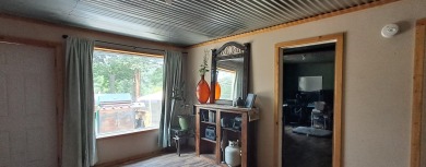 Welcome to this charming 2-bedroom, 1-bath getaway, perfectly on The Loon Golf Resort in Michigan - for sale on GolfHomes.com, golf home, golf lot