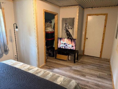 Welcome to this charming 2-bedroom, 1-bath getaway, perfectly on The Loon Golf Resort in Michigan - for sale on GolfHomes.com, golf home, golf lot