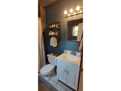 Welcome to this charming 2-bedroom, 1-bath getaway, perfectly on The Loon Golf Resort in Michigan - for sale on GolfHomes.com, golf home, golf lot