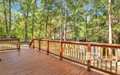 Welcome to this charming completely renovated home nestled in on Lake Forest Yacht and Country Club in Alabama - for sale on GolfHomes.com, golf home, golf lot