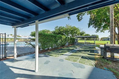 Bright and Stunning Corner unit with lake & Golf views, located on Oriole Golf and Tennis Club in Florida - for sale on GolfHomes.com, golf home, golf lot