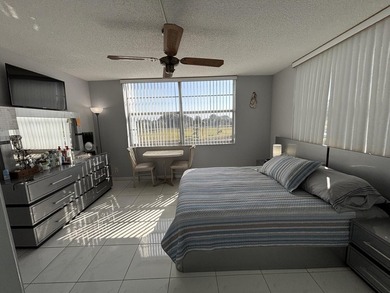 Bright and Stunning Corner unit with lake & Golf views, located on Oriole Golf and Tennis Club in Florida - for sale on GolfHomes.com, golf home, golf lot