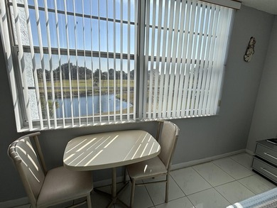 Bright and Stunning Corner unit with lake & Golf views, located on Oriole Golf and Tennis Club in Florida - for sale on GolfHomes.com, golf home, golf lot