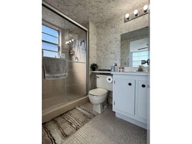 Bright and Stunning Corner unit with lake & Golf views, located on Oriole Golf and Tennis Club in Florida - for sale on GolfHomes.com, golf home, golf lot