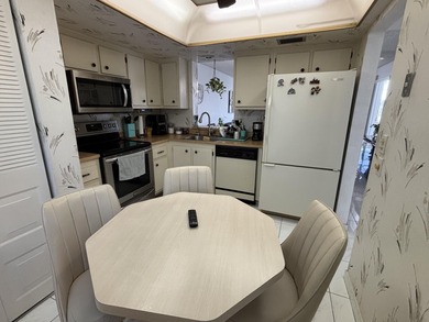 Bright and Stunning Corner unit with lake & Golf views, located on Oriole Golf and Tennis Club in Florida - for sale on GolfHomes.com, golf home, golf lot