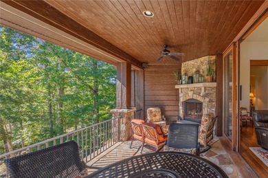 Breathtaking views of Lake Keowee's only waterfall frame this on The Cliffs At Keowee Falls in South Carolina - for sale on GolfHomes.com, golf home, golf lot