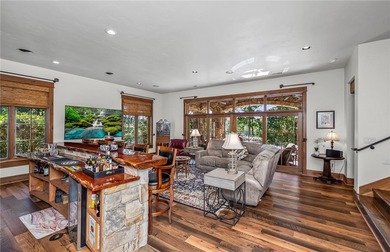 Breathtaking views of Lake Keowee's only waterfall frame this on The Cliffs At Keowee Falls in South Carolina - for sale on GolfHomes.com, golf home, golf lot